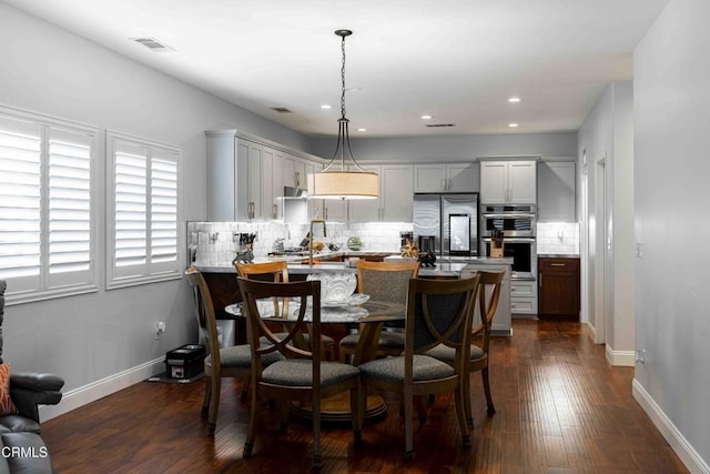 dining space with visible vents, recessed lighting, baseboards, and dark wood-style flooring