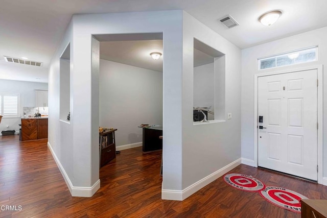 foyer featuring visible vents and wood finished floors