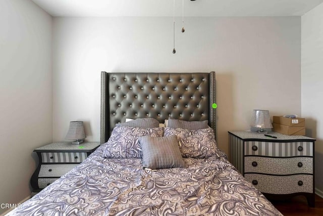 bedroom featuring wood finished floors