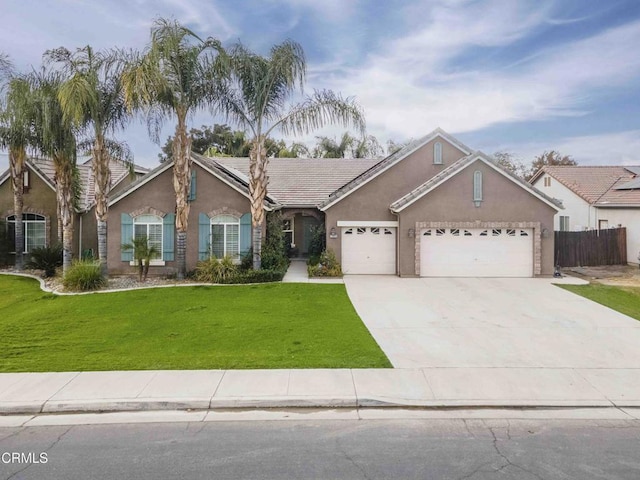 single story home featuring fence, a front yard, stucco siding, a garage, and driveway