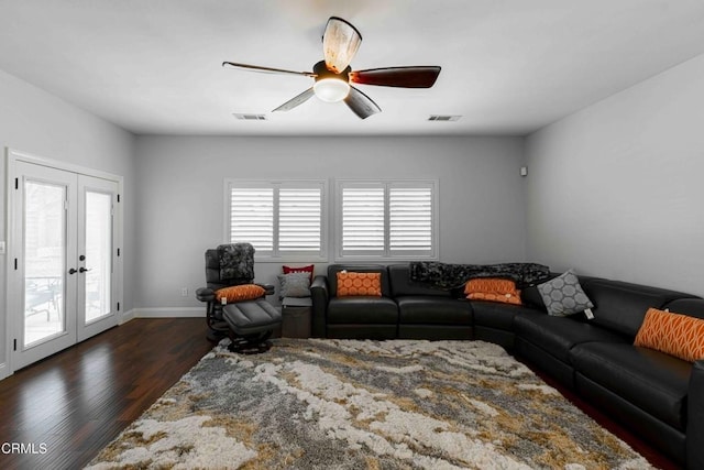 living area with visible vents, french doors, ceiling fan, and dark wood-style flooring