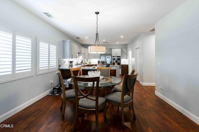 dining area featuring recessed lighting, dark wood-style floors, visible vents, and baseboards