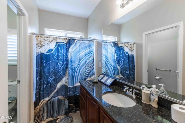 full bath with visible vents, toilet, vanity, and a shower with shower curtain