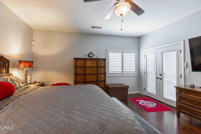 bedroom with access to exterior, visible vents, baseboards, ceiling fan, and wood finished floors