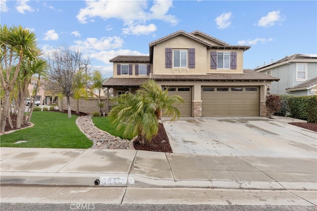 view of front of home with a front lawn, stucco siding, driveway, stone siding, and an attached garage