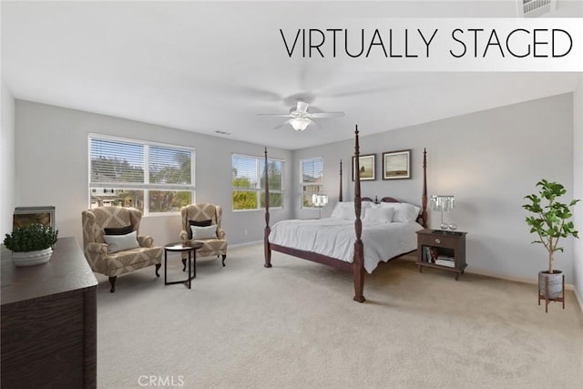 bedroom featuring baseboards, light colored carpet, and ceiling fan