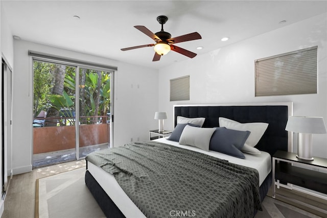 bedroom with a ceiling fan, access to outside, and recessed lighting