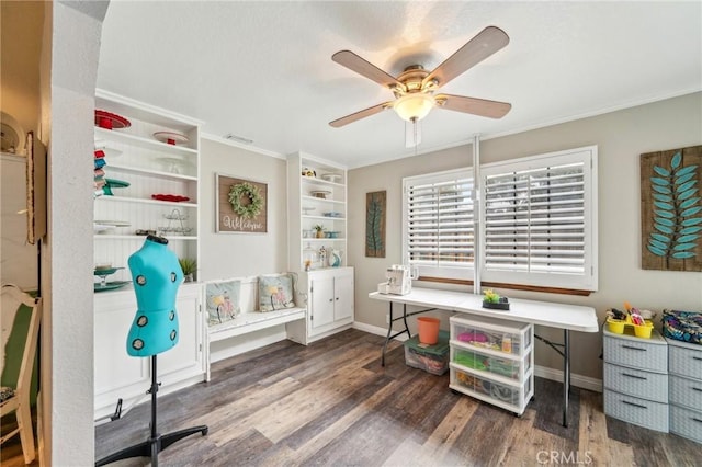 interior space with ceiling fan, wood finished floors, and ornamental molding