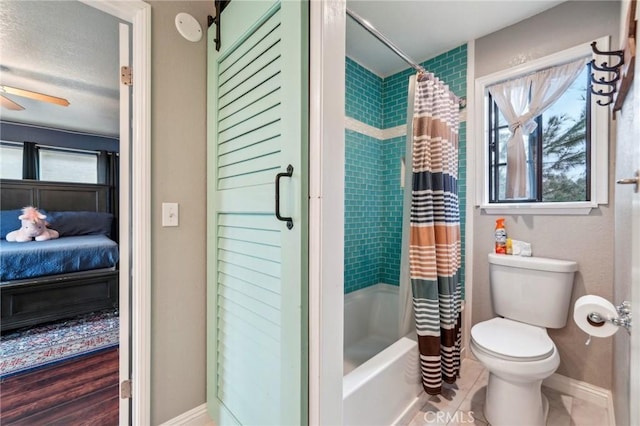 bathroom with plenty of natural light, toilet, ensuite bathroom, and a ceiling fan