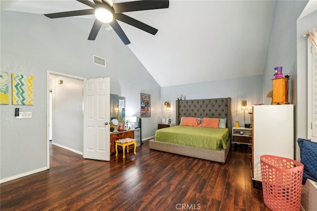 bedroom with visible vents, baseboards, high vaulted ceiling, and wood finished floors