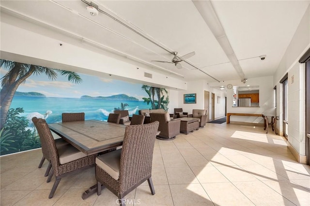 dining room with visible vents, light tile patterned flooring, and a ceiling fan