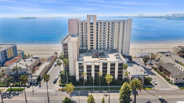 birds eye view of property featuring a view of the beach and a water view