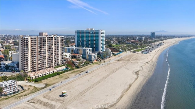 bird's eye view with a city view, a beach view, and a water view