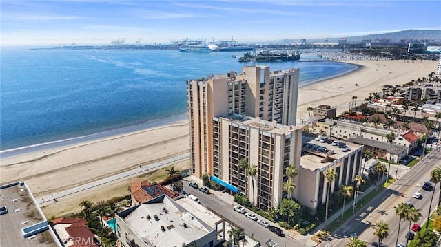 birds eye view of property with a city view, a beach view, and a water view