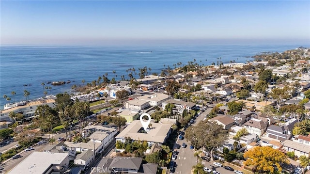 drone / aerial view featuring a residential view and a water view