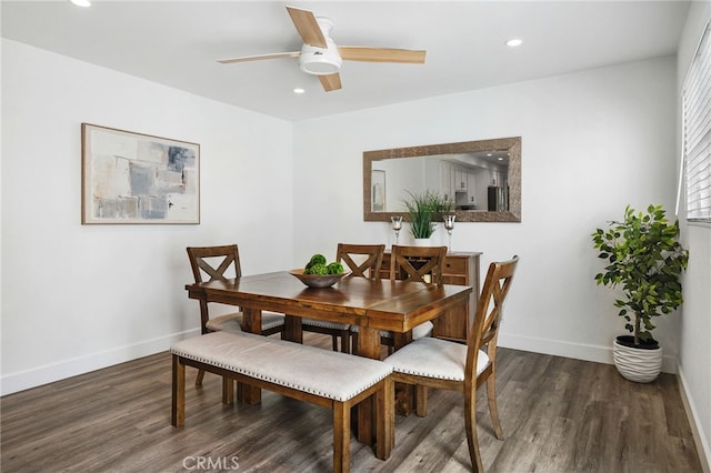 dining room with recessed lighting, baseboards, and wood finished floors