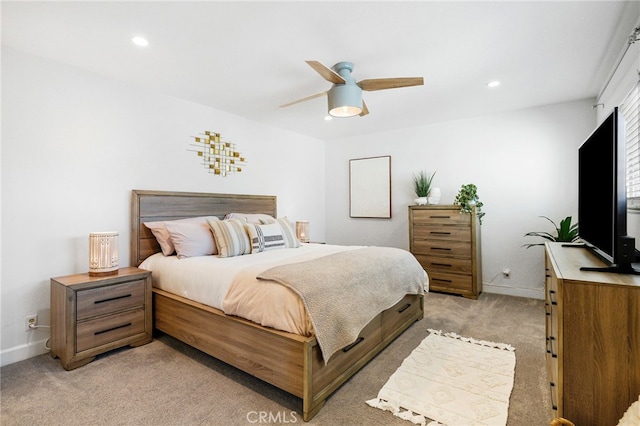 bedroom featuring light carpet, recessed lighting, baseboards, and ceiling fan