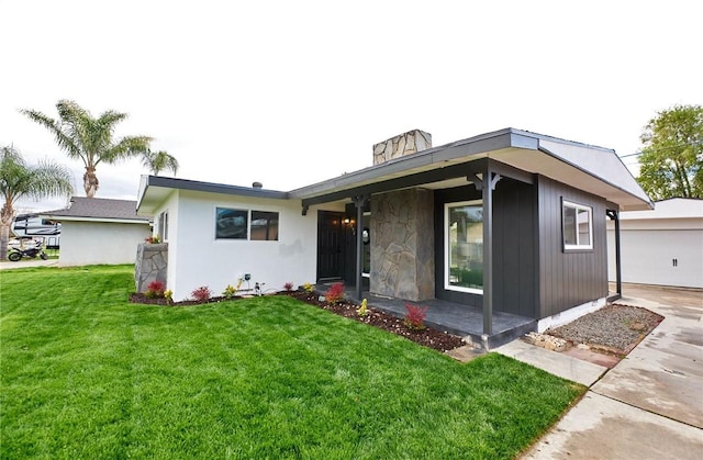 view of front of home with a garage and a front yard