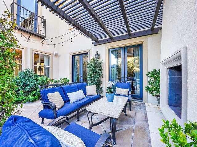 view of patio / terrace featuring outdoor lounge area and a pergola