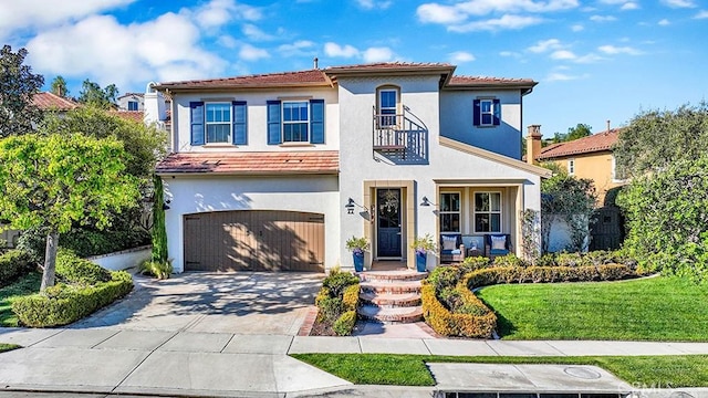 mediterranean / spanish house with a balcony, an attached garage, stucco siding, concrete driveway, and a tile roof