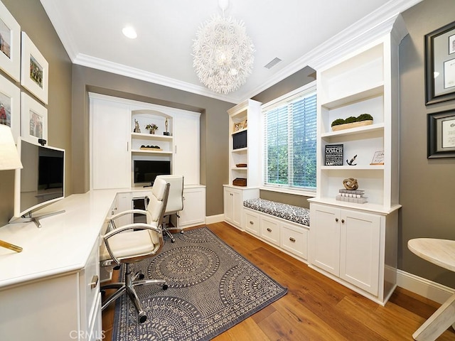 office area with visible vents, baseboards, dark wood finished floors, ornamental molding, and an inviting chandelier