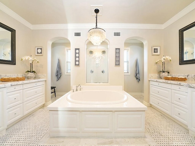 bathroom with a bath, a walk in shower, visible vents, and ornamental molding