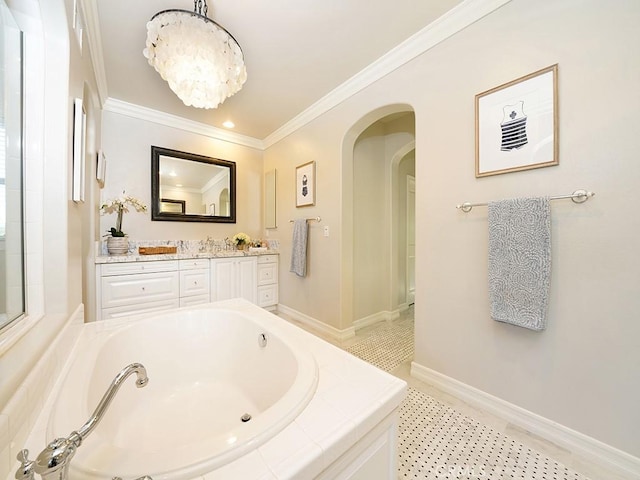 full bathroom with a notable chandelier, baseboards, a garden tub, and crown molding