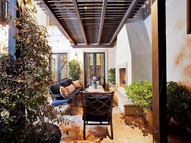 view of patio / terrace featuring an outdoor living space, french doors, and a pergola