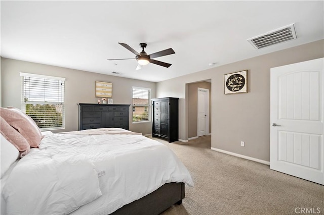 bedroom featuring light carpet, visible vents, ceiling fan, and baseboards