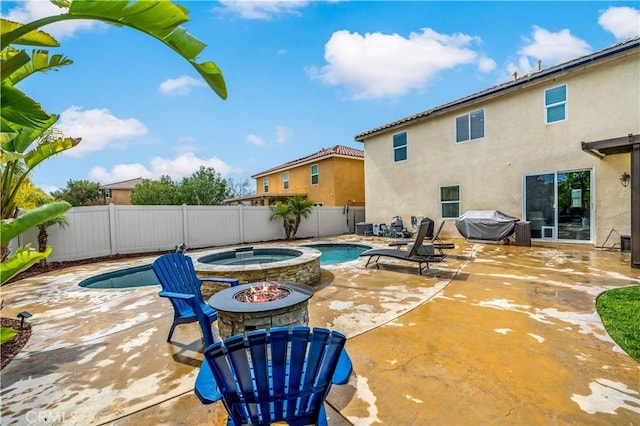 view of swimming pool with a fenced in pool, an outdoor fire pit, area for grilling, a fenced backyard, and a patio area