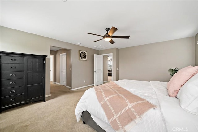 bedroom featuring visible vents, light colored carpet, baseboards, and ceiling fan