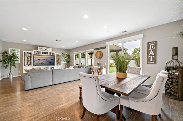 dining area featuring visible vents, recessed lighting, baseboards, and wood finished floors