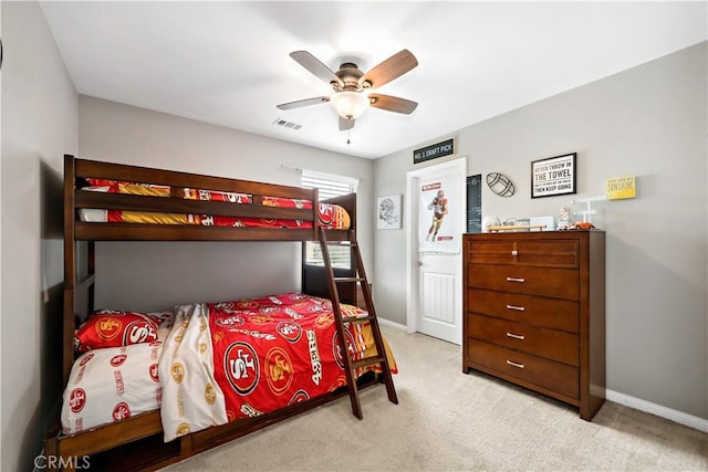 bedroom with visible vents, baseboards, carpet, and a ceiling fan