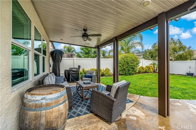 view of patio / terrace with a fenced backyard and ceiling fan