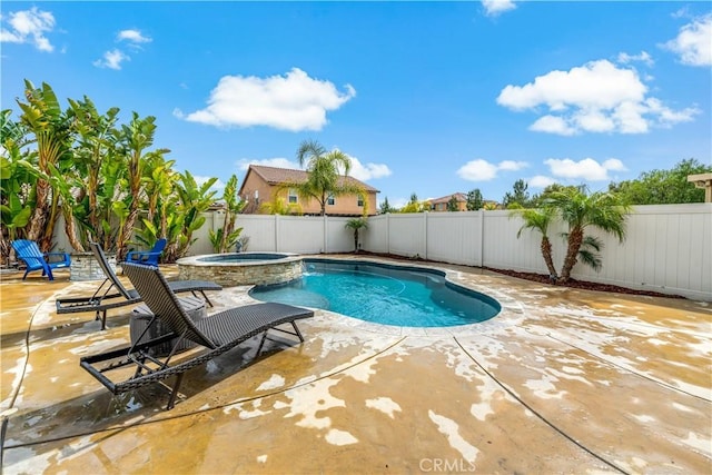 view of swimming pool with a pool with connected hot tub, a patio area, and a fenced backyard