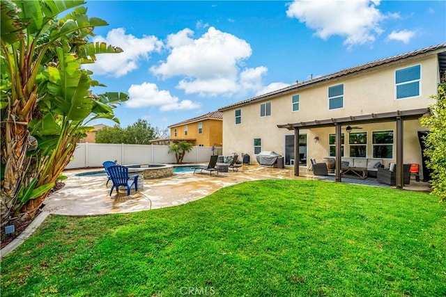 rear view of house featuring an outdoor living space, stucco siding, a yard, a fenced backyard, and a patio area