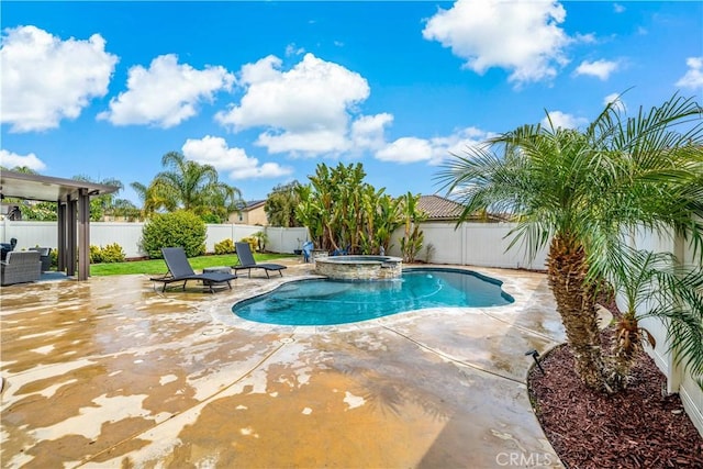 view of swimming pool featuring a patio area, a fenced backyard, and a pool with connected hot tub