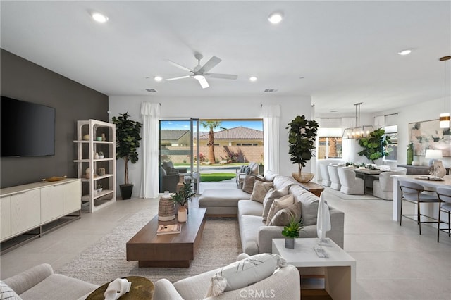 living area with recessed lighting, a ceiling fan, and visible vents