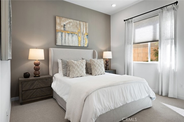 carpeted bedroom featuring baseboards