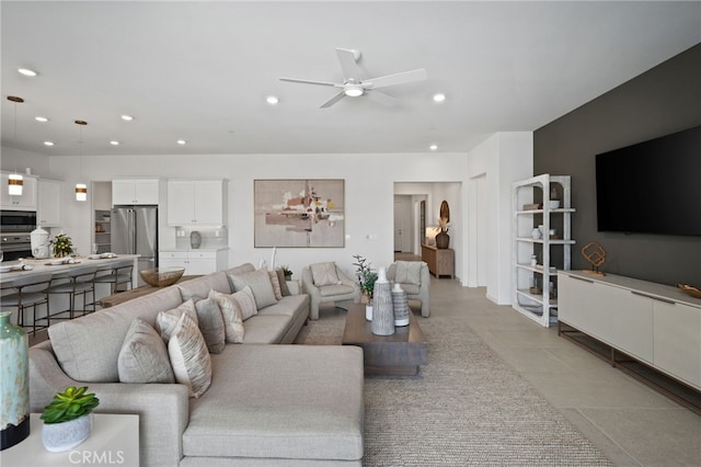 living area with recessed lighting and ceiling fan