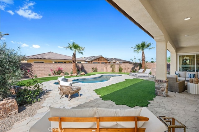 view of swimming pool featuring a patio area, a fenced in pool, a fenced backyard, and an outdoor hangout area