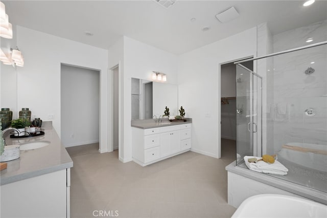 bathroom featuring vanity, baseboards, recessed lighting, a stall shower, and a washtub