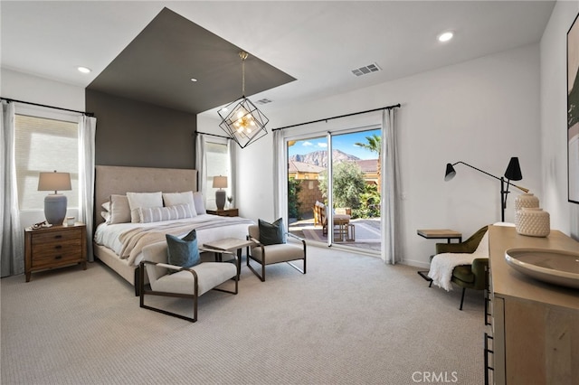 bedroom with access to exterior, visible vents, baseboards, light colored carpet, and recessed lighting