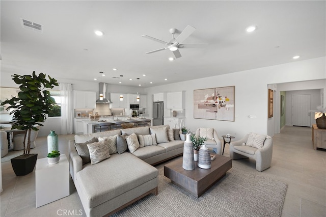 living area with recessed lighting, a ceiling fan, visible vents, and light tile patterned floors