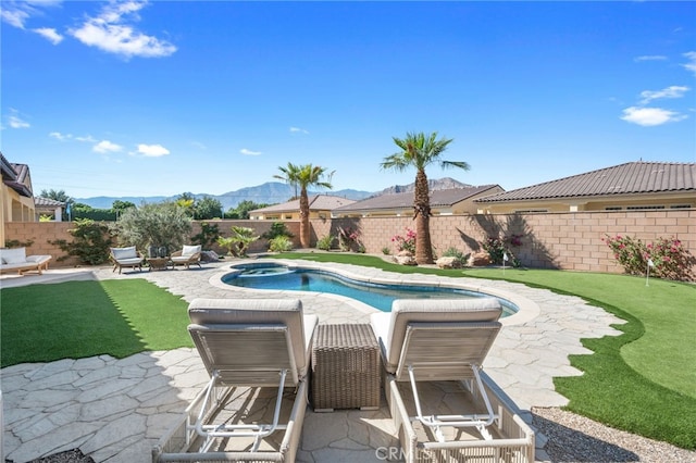 view of pool with a fenced in pool, a mountain view, a fenced backyard, an in ground hot tub, and a patio