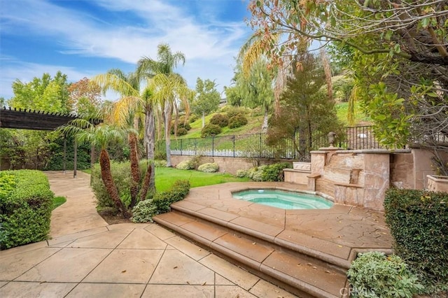 view of pool with an in ground hot tub, a pergola, a patio, and fence