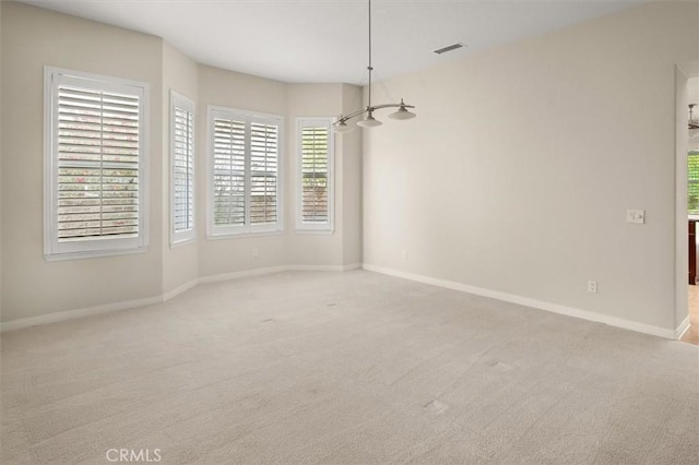 unfurnished dining area featuring visible vents, baseboards, and carpet flooring