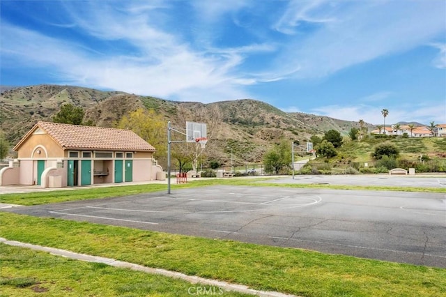 view of basketball court with a mountain view and community basketball court