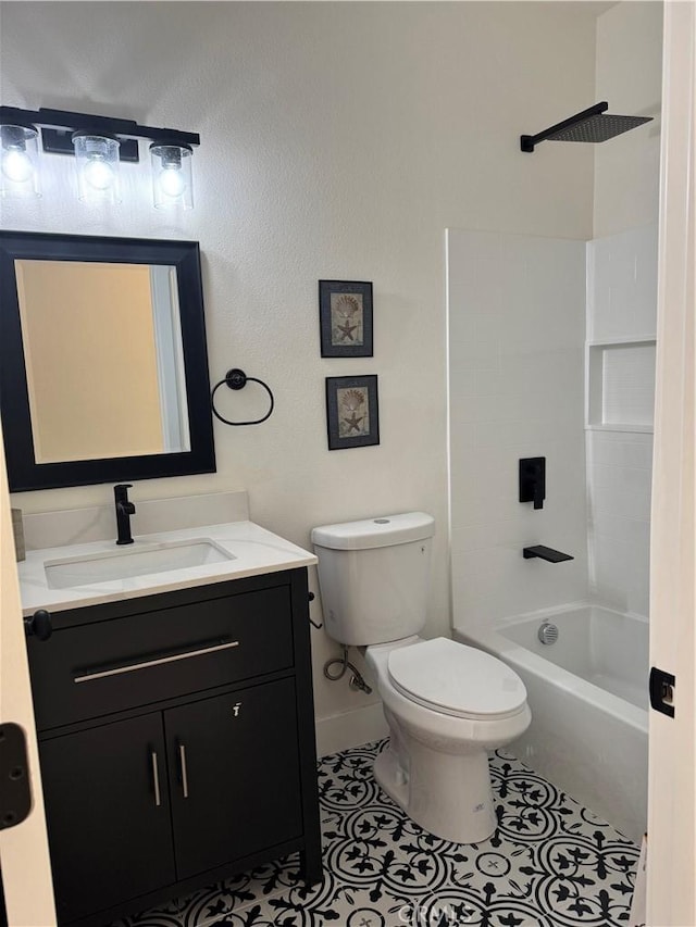 full bath featuring vanity, baseboards,  shower combination, tile patterned flooring, and toilet