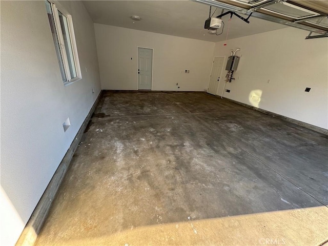 garage with baseboards and a garage door opener